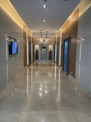 a hallway of a building with a long hallwayngth at Molly Shore Getaway Unit 1277 in Manila