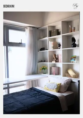 a bedroom with a bed and a book shelf at Condo in BGC near Grand Hyatt Hotel in Manila