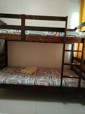 two bunk beds in a room with a colorful blanket at 5 Years Legit Staycation Infront of Moa, 2 Bedroom with Balcony at Sea Residences Tower A, Near Arena , Smx, Picc, Dfa Macapagal, World Trade, Star City, Ayala Mall, & Naia Sea Residences Tower A in Manila