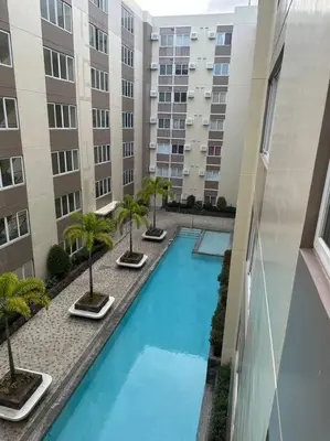 an overhead view of a swimming pool in a building at Affordable Condo Near Nuvali in Silang