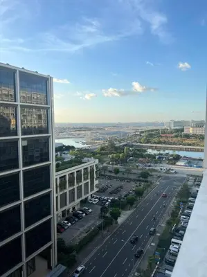 a view of a city with a building and a street at Katrina Suite infront of Mall of Asia and Bay area in Manila