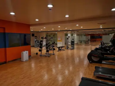 a gym with several treadmills and exercise bikes at Cute Studio Unit w/ Big Windows - B Morgan T1 in Manila
