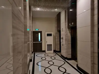 a hallway with a elevator in a building at Cute Studio Unit w/ Big Windows - B Morgan T1 in Manila