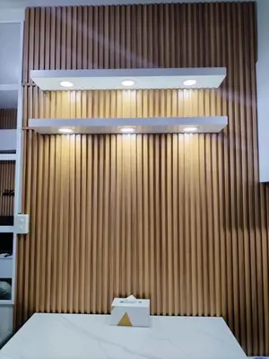a room with a wooden wall with a bed and a box at Paranaque Manila Bloom residences in Manila