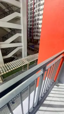 an empty escalator in a city with buildings at Paranaque Manila Bloom residences in Manila