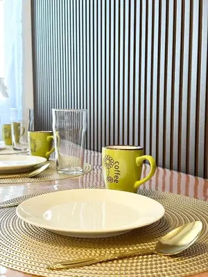 a table with a plate and two cups on it at Mall of Asia MOA S Residences , IKEA Pasay , NAIA Airport , Manila Bay in Manila