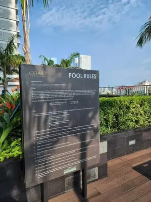 a sign for a resort on a wooden deck at CitiBay View Staycation in Manila