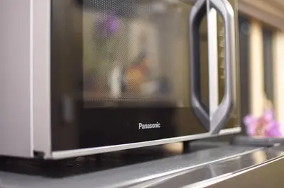 a microwave oven sitting on top of a kitchen counter at CitiBay View Staycation in Manila