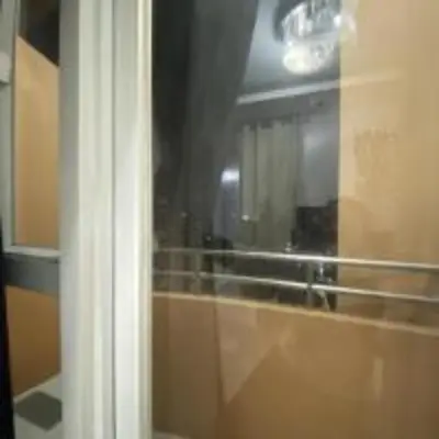 a reflection of a mirror in a bathroom window at Book Now for Free Pool And Sauna Access Inside Prime Location Of Manila near US Embassy, NAIA, Makati, BGC, Mall of Asia, Chinatown. Immerse in Sea View Balcony for Limited Time Offer This Month Click Here Now in Manila