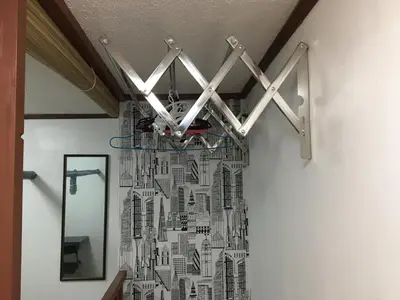 a bathroom with a black and white wall at Stay in Manila, Cambridge Village in Cainta