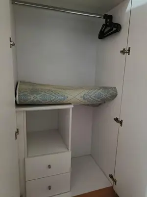a bedroom with a bed on a shelf at Eastwood Staycation Home with Stunning City View minimum 2nights stay in Manila