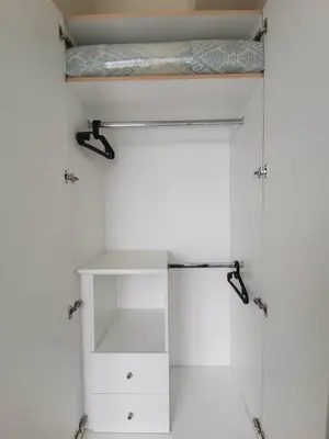 a closet with a bed on top of it at Eastwood Staycation Home with Stunning City View minimum 2nights stay in Manila