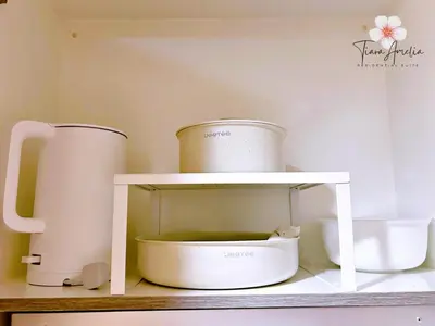 a white shelf with two pots and a mixer at Condo near MOA Pasay and NAIA Manila Airport in Manila