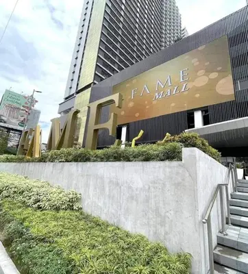 a building with a sign for a fancy mall at Fame Residence 701 Tower 2 in Manila