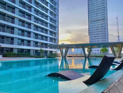 a swimming pool in the middle of a building at Fame Residence 701 Tower 2 in Manila