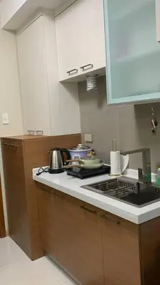 a kitchen with a stove and a counter top at Milia Condo w/ Free use of Swimming pool & Gym in Manila
