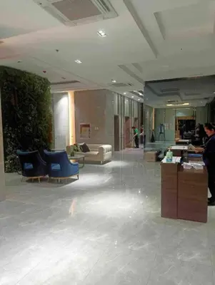 a large lobby with blue chairs in a building at Milia Condo w/ Free use of Swimming pool & Gym in Manila