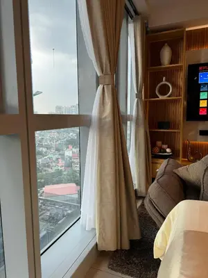 a bedroom with a window with a view of a city at Staycations Up Above 14 @ BGC 1BR in Manila
