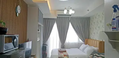 a small bedroom with a bed and a window at Shell Residences by Amonbrey Suite nr airport in Manila