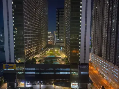 a view of a city at night with tall buildings at Buenbyahe Cozy Affordable Place at Urban Deca Tower along EDSA Shaw MRT walking distance in megamall in Manila