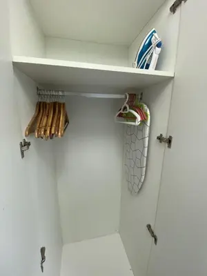 a closet with a shelf and some utensils at Cozy Studio with SM Jazz Mall 