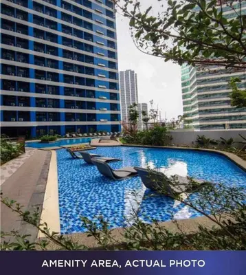 an infinity areaactual photo of a city with buildings at 1 Bedroom with Balcony at Air Residences, Makati in Manila
