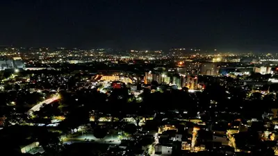 a view of a city at night with lights at ELUDE Designer Suite Pasig - Prime Location in Manila