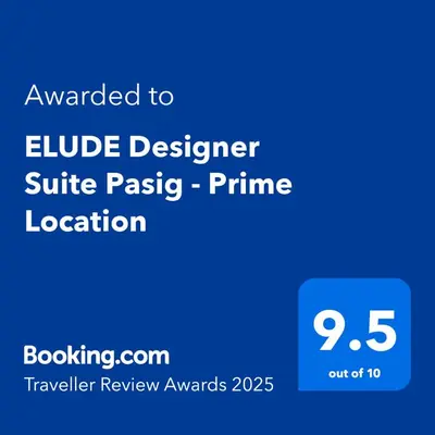 a blue screen with the text awarded to a blue designer suite passive prime location at ELUDE Designer Suite Pasig - Prime Location in Manila
