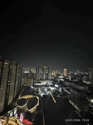 a view of a city at night with buildings at Birch Tower a3 front of Robinson Mla FREEpool in Manila