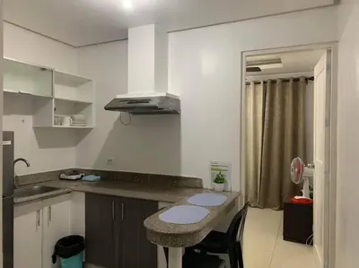 a kitchen with a counter and a sink in it at Birch Tower a3 front of Robinson Mla FREEpool in Manila