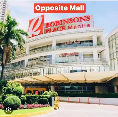 a large building with a sign on top of it at Birch Tower a3 front of Robinson Mla FREEpool in Manila