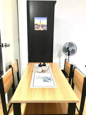 a wooden table with a picture of the eiffel tower at The Escape Pad 7 in Manila