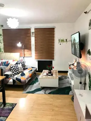 a living room with a couch and a table at The Escape Pad 7 in Manila