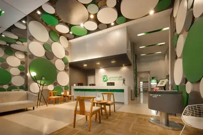 a restaurant with chairs and a table in a room at Go Hotels Ortigas Center in Manila