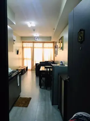 a living room with a couch and a table at Long term Rental of 2 BR Condo @Malate, Manila (opp Robinson Place Mall) in Manila
