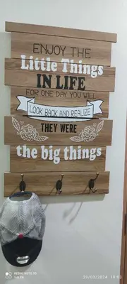 a wooden sign hanging on a wall at Avery's Place at SMDC RED RES. in Manila
