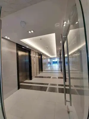 a reflection of a hallway in a mirror in a building at Avery's Place at SMDC RED RES. in Manila