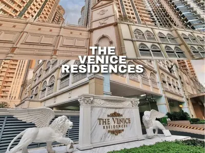 a statue of two white horses outside of a building at Modern Condo At Venice Residences Bgc #vlrb29k in Manila