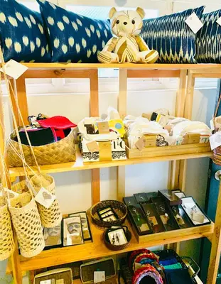 a shelf filled with lots of items on a couch at The Henry Hotel Manila in Manila
