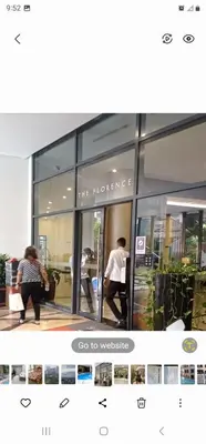 two people are sitting in a store window at Grand Canal Penthouse! in Manila