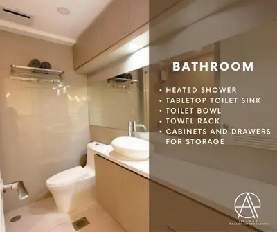 a bathroom with a white toilet and a sink at Casa Escudero in Manila