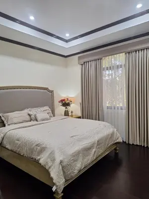 a bedroom with a large bed and a window at La Dolce Vita Villa in Santa Rosa