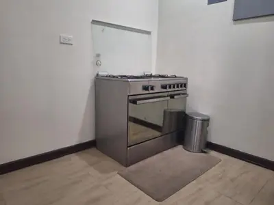 a kitchen with a stainless steel stove in a room at La Dolce Vita Villa in Santa Rosa