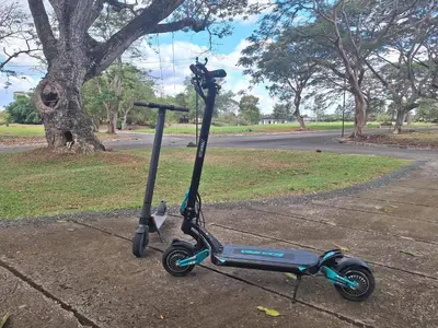 a scooter parked on the side of a street at La Dolce Vita Villa in Santa Rosa