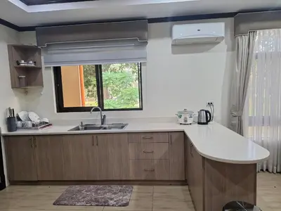 a kitchen with a sink and a window at La Dolce Vita Villa in Santa Rosa