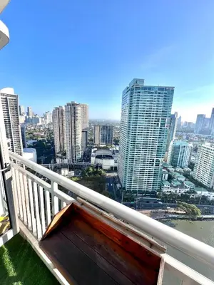 a balcony with a view of a city at Acqua Private Residences - Iguazu Tower 36th flr Mandaluyong - Makati in Manila