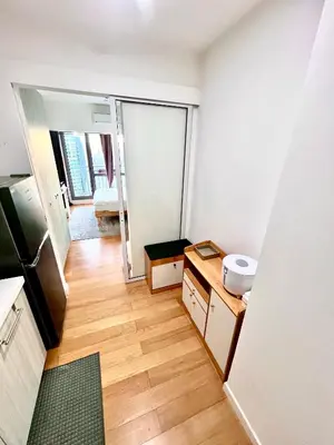 a small kitchen with a sink and a mirror at Acqua Private Residences - Iguazu Tower 36th flr Mandaluyong - Makati in Manila