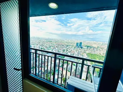 a view of a city from a window at Mon ciel suite Spacious 1BR Air Residence SMDC in Manila