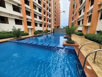 a swimming pool in the middle of a building at Paseo Verde Condominium in Manila