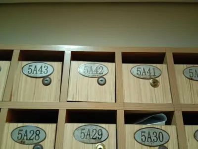 a wooden cabinet with numbers on top of it at Paseo Verde Condominium in Manila